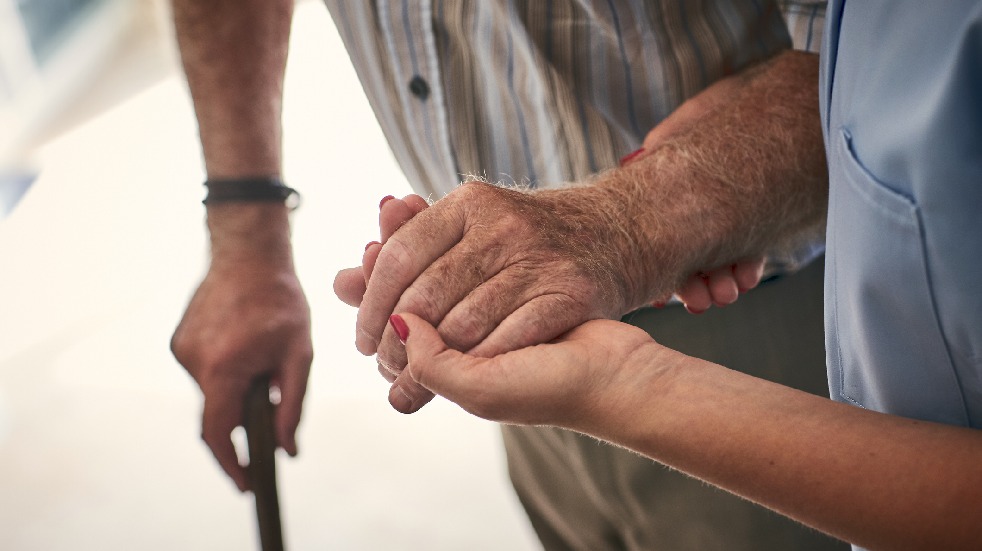 nurse holding patient's arm